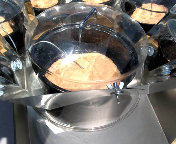 Clear dome polycarbonate pot cover being used to bake bread in Octagon Parabolic