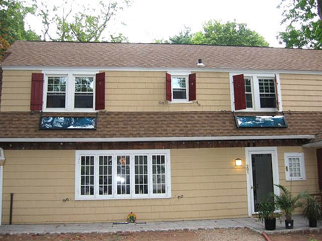 Two BISFA 8' heating mounted on roof area below two windows