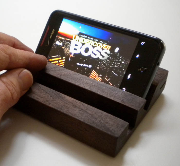 Incredible Droid smartphone sitting horizontally in the new SmartPhone Mirror Stand with mirror removed