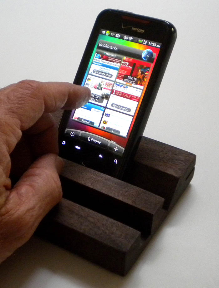 Incredible Droid smartphone sitting vertically in the new SmartPhone Mirror Stand with mirror removed