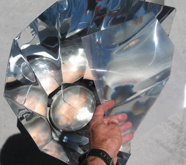 Optional $39 Fresnel solar smoker lens burns wood chips inside pot